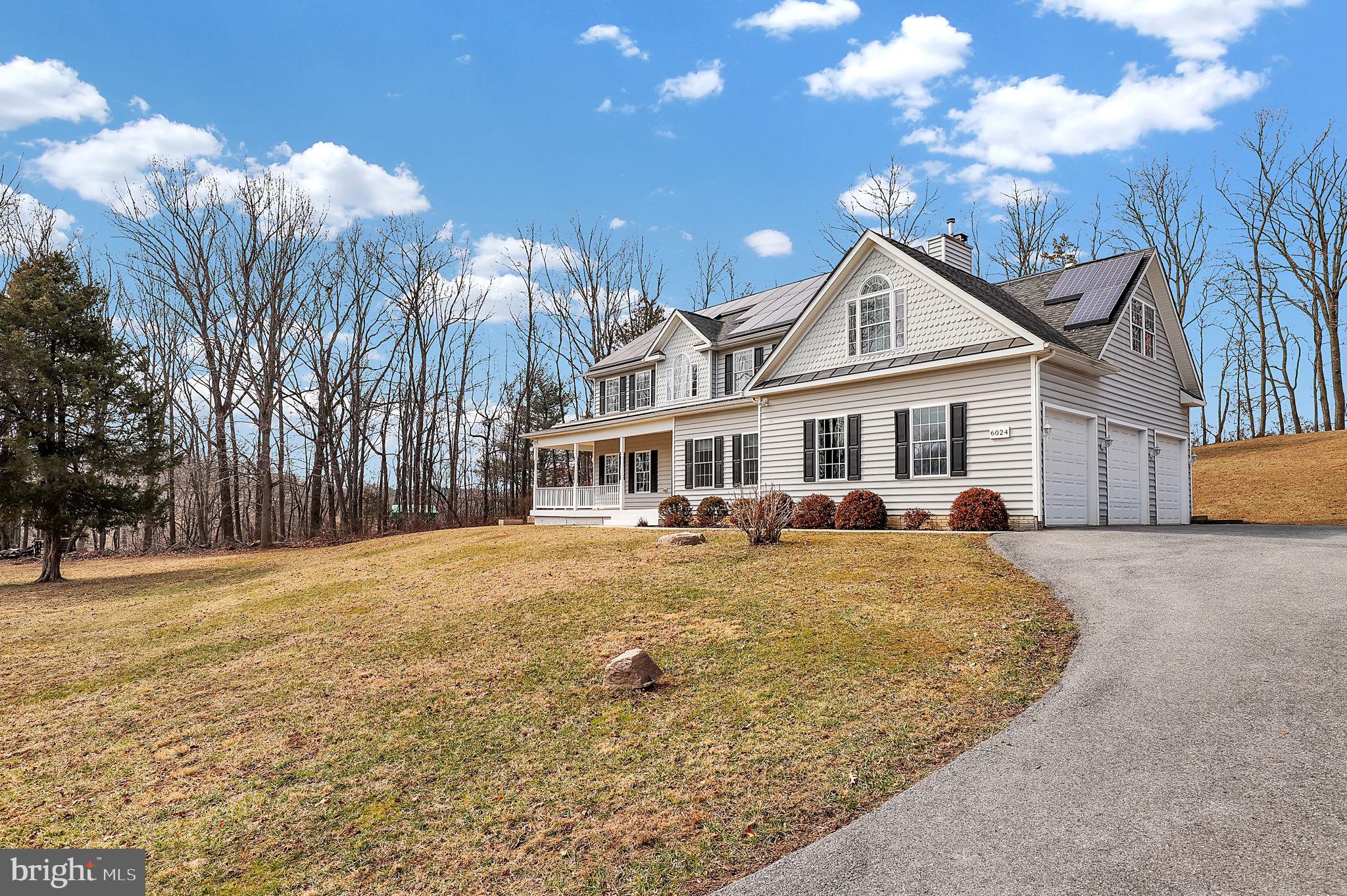 6024 Old Bohn Road Mount Airy, MD 21771 - Photo 4 of 46 a front view of a house with a yard and trees