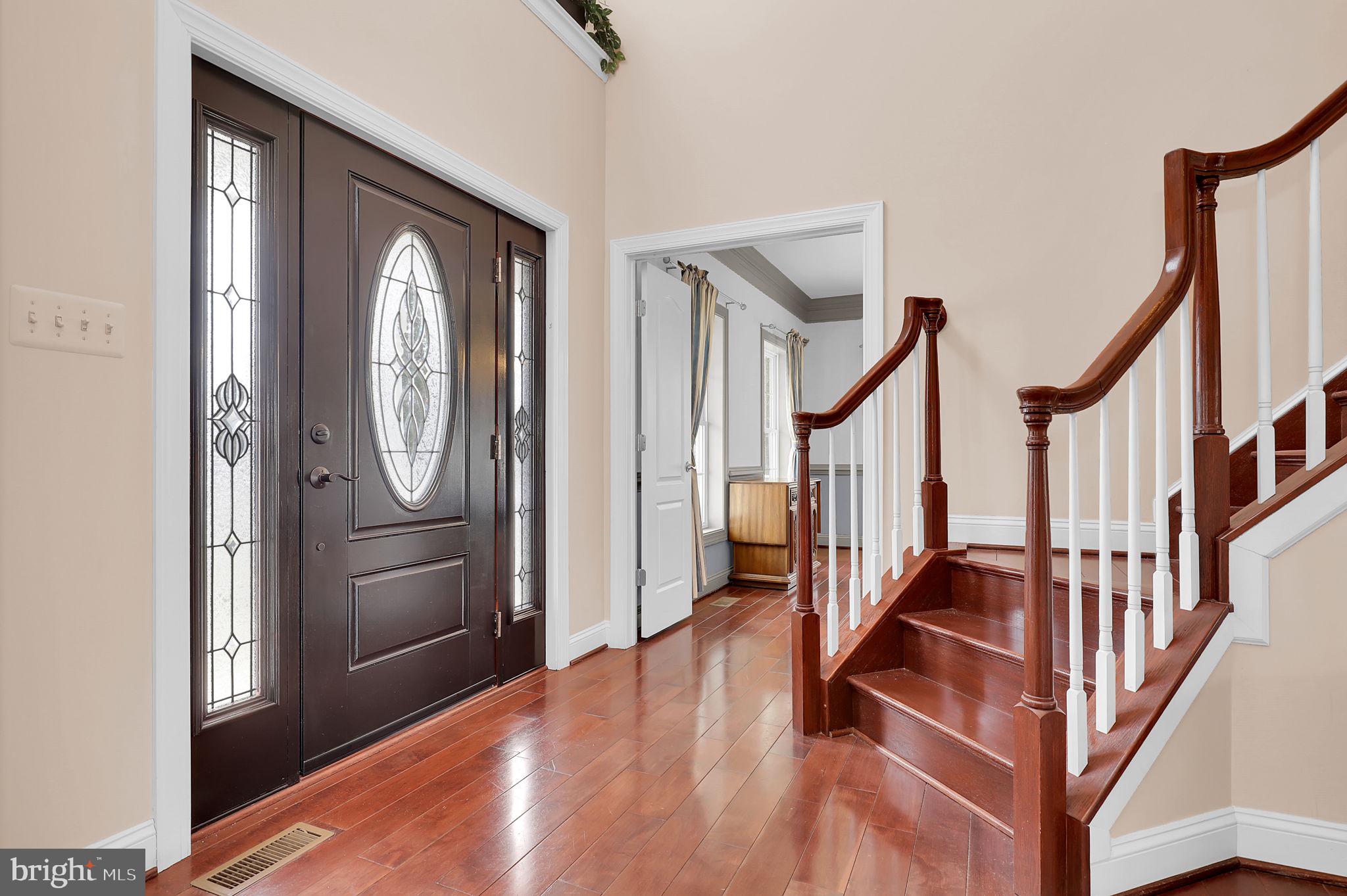 6024 Old Bohn Road Mount Airy, MD 21771 - Photo 5 of 46 a view of a hallway with wooden floor and staircase