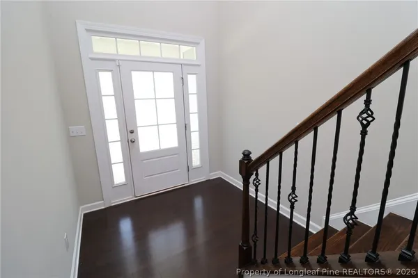 a view of entryway with wooden floor
