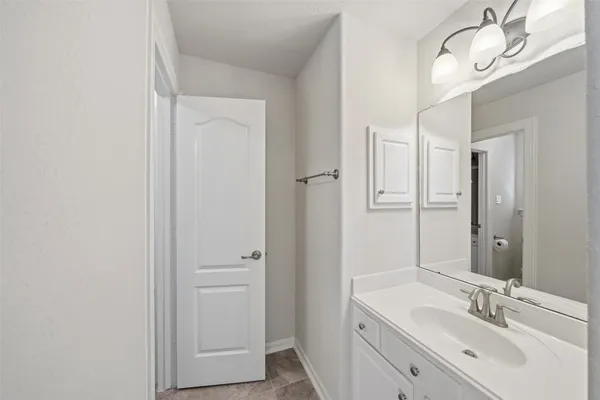 a bathroom with a double vanity sink a mirror and a shower