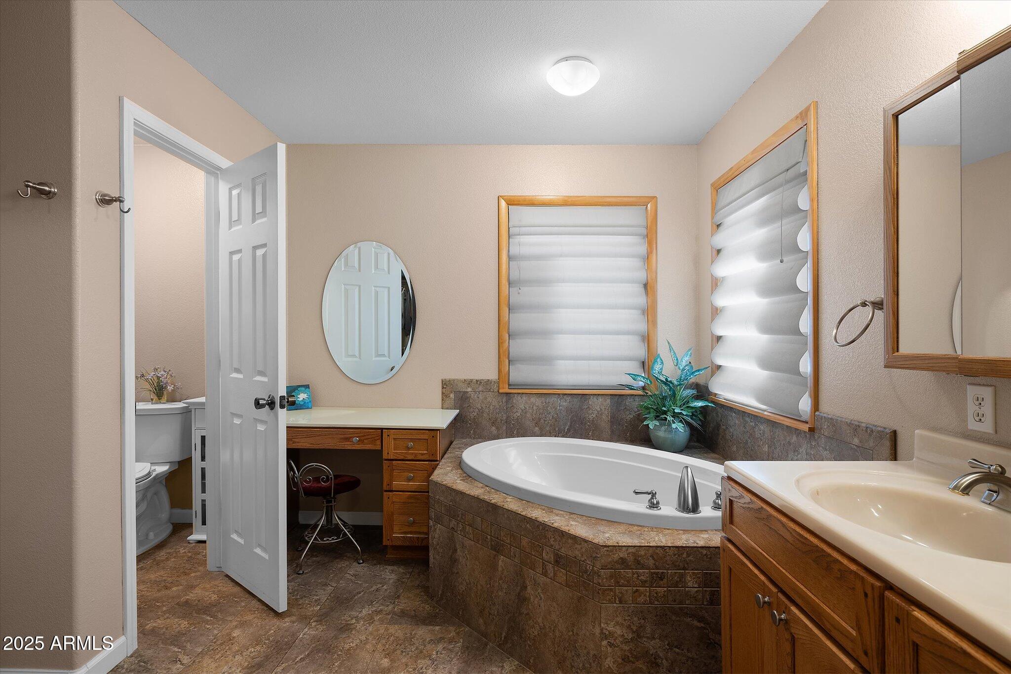129 West Mt Ord Circle Payson, AZ 85541 - Photo 11 of 40 a bathroom with a granite countertop sink mirror bathtub and toilet