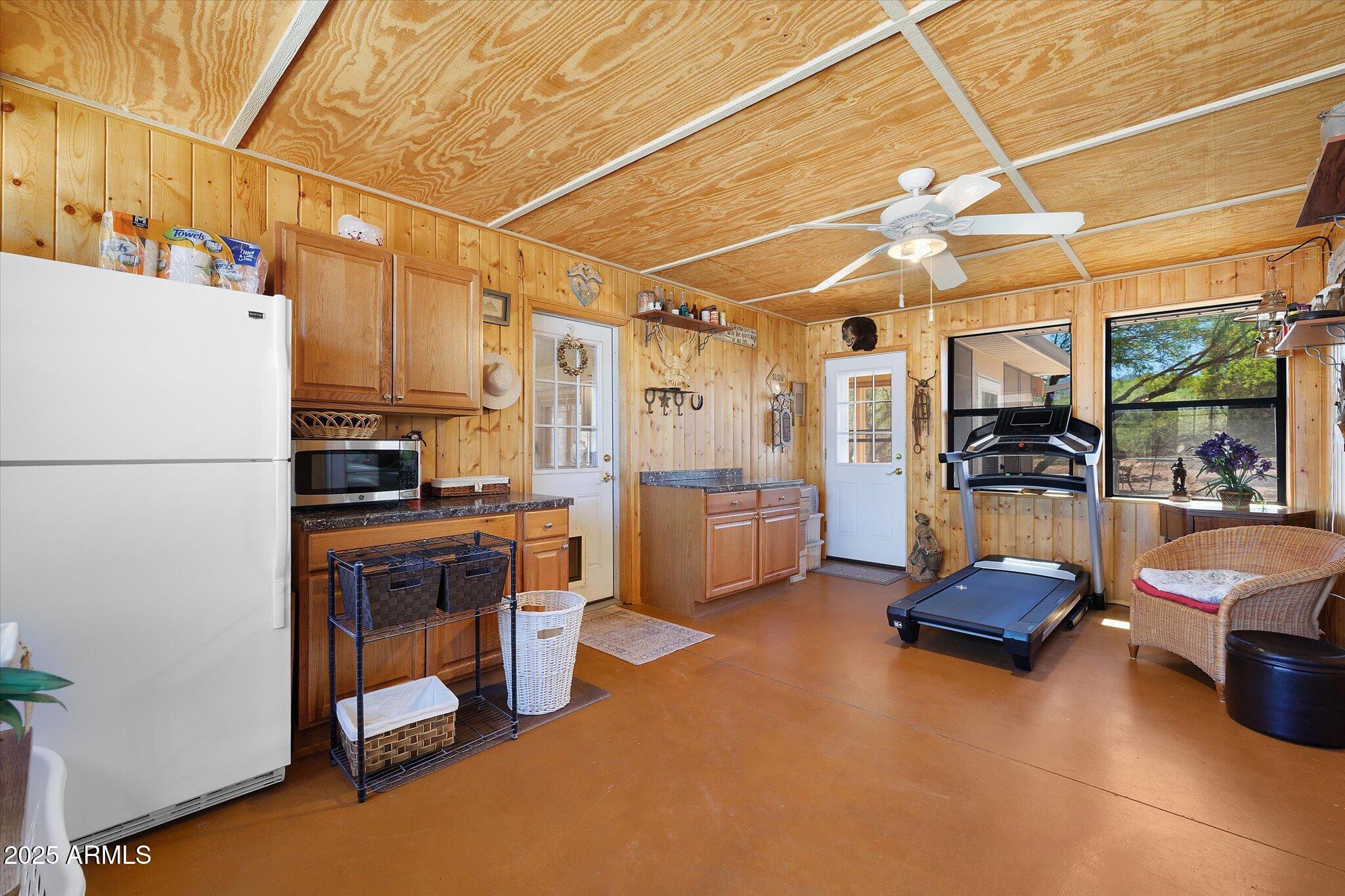 129 West Mt Ord Circle Payson, AZ 85541 - Photo 24 of 40 a living room with furniture and a refrigerator