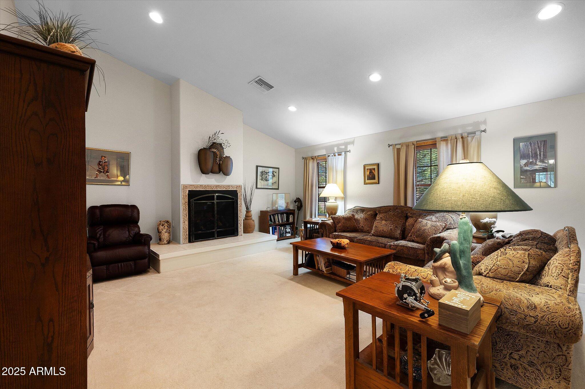 129 West Mt Ord Circle Payson, AZ 85541 - Photo 5 of 40 a living room with furniture and a fireplace