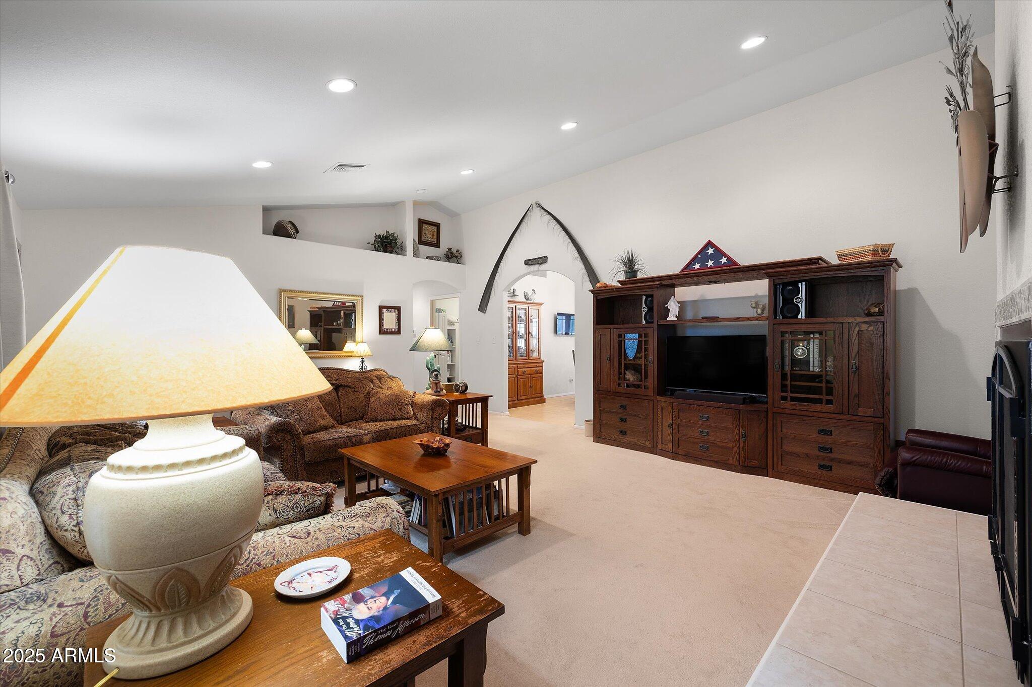 129 West Mt Ord Circle Payson, AZ 85541 - Photo 6 of 40 a living room with furniture a flat screen tv and kitchen view