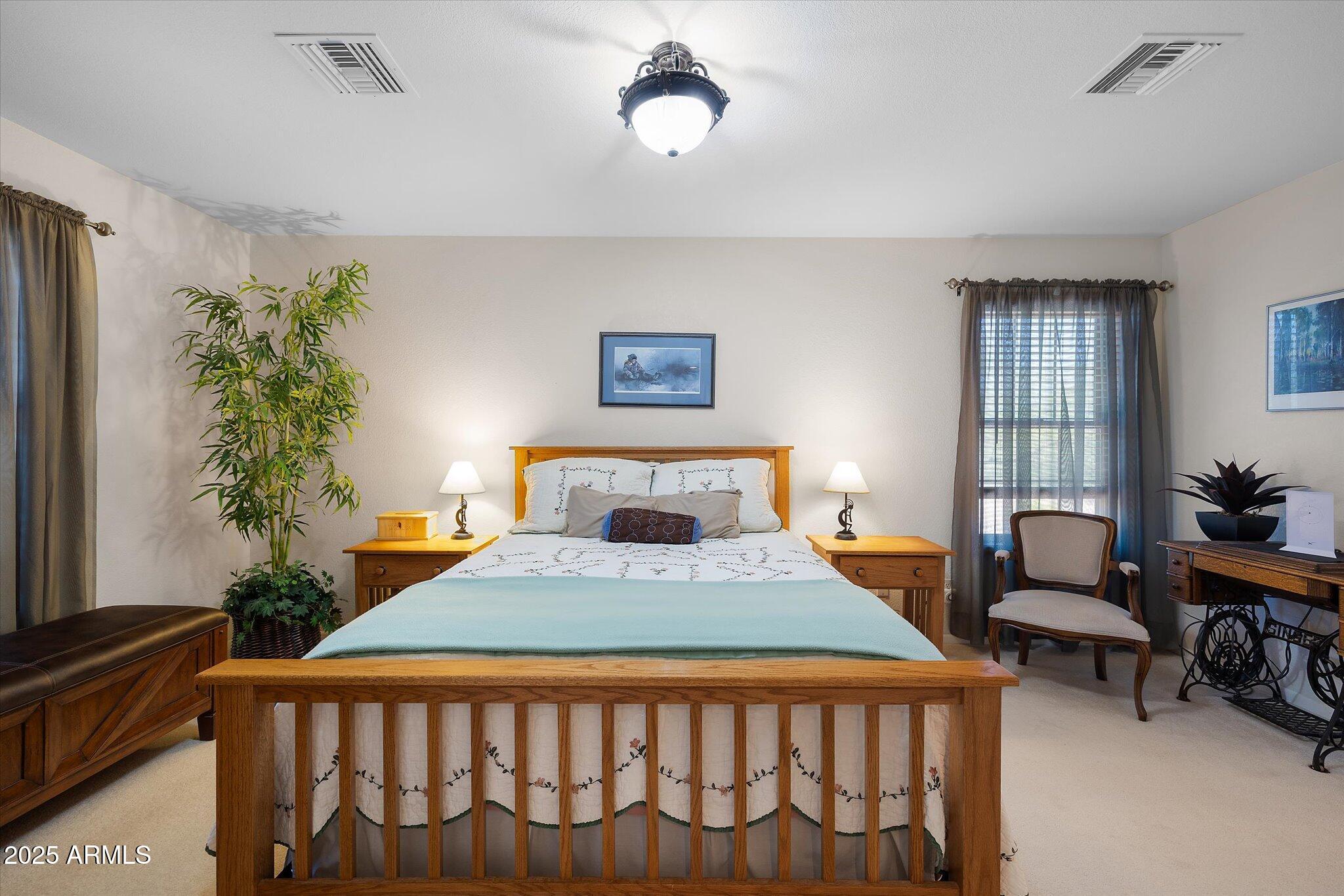 129 West Mt Ord Circle Payson, AZ 85541 - Photo 7 of 40 a bedroom with a bed and a table in it