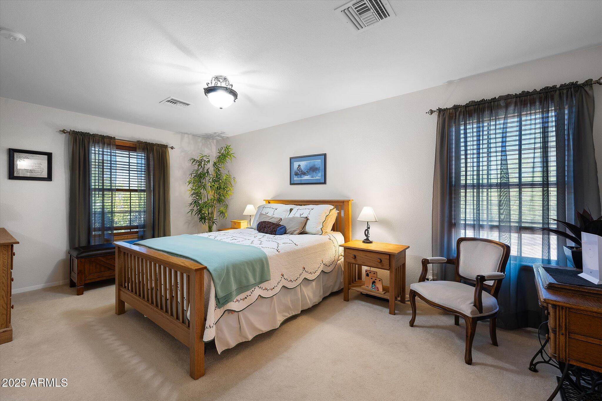 129 West Mt Ord Circle Payson, AZ 85541 - Photo 8 of 40 a bedroom with a bed chair and window