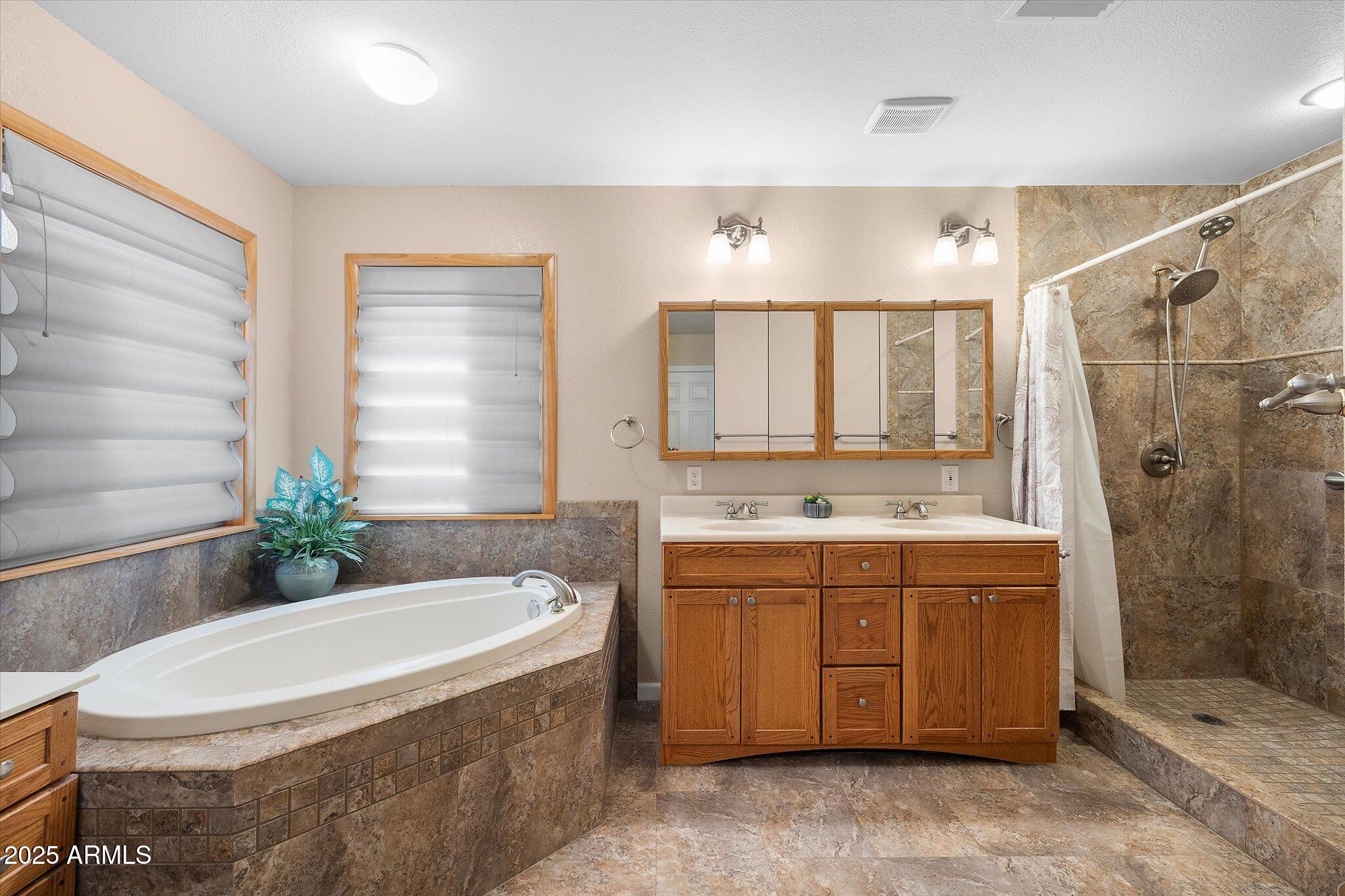 129 West Mt Ord Circle Payson, AZ 85541 - Photo 10 of 40 a bathroom with a granite countertop sink toilet and shower