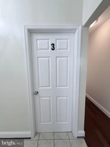a living room with hard wood floors
