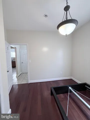 a bathroom with a sink vanity and toilet