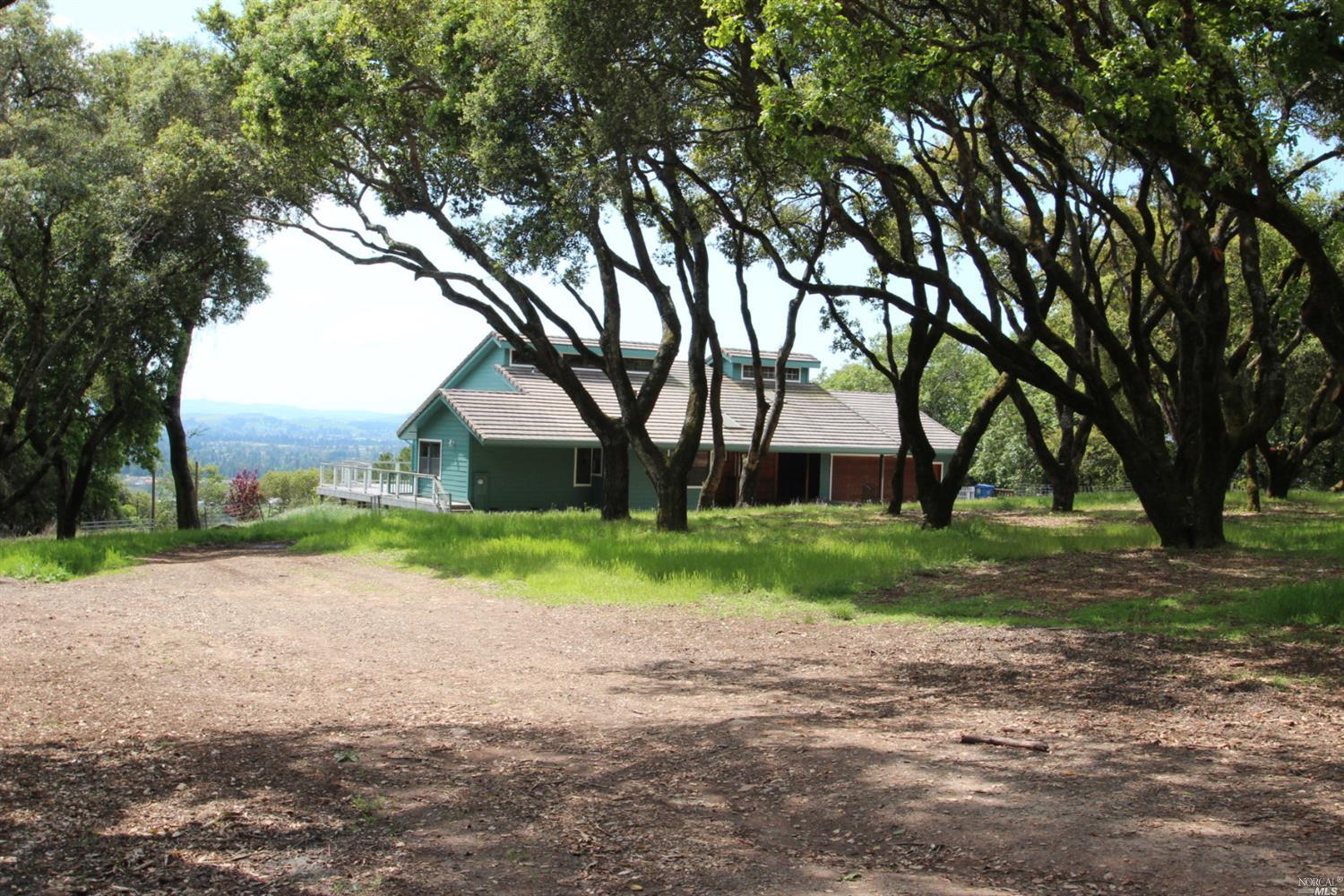 1444 Warrington Road Santa Rosa, CA 95404 - Photo 1 of 1 a house is sitting in middle od the grass