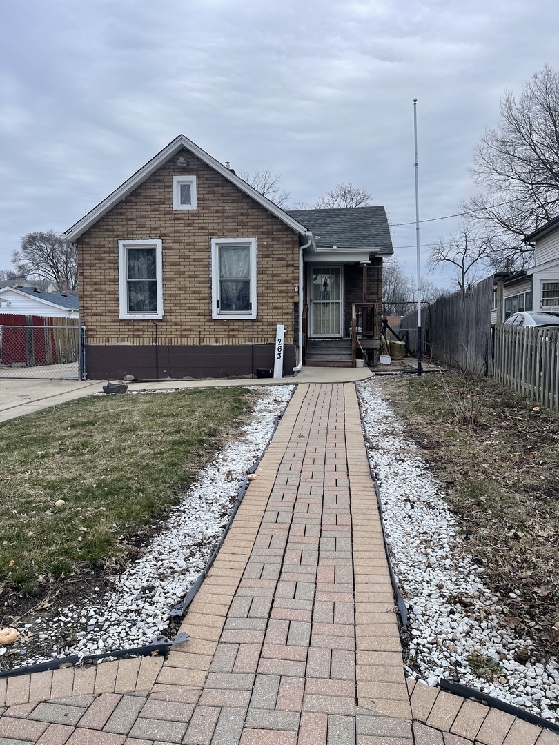 263 Beach Street Aurora, IL 60505 - Photo 1 of 6 a front view of a house with a yard