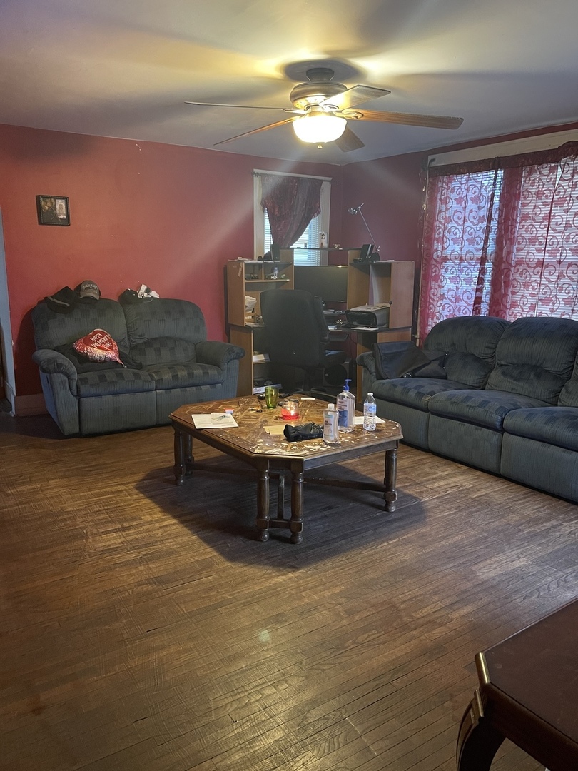 263 Beach Street Aurora, IL 60505 - Photo 3 of 6 a living room with furniture and a fireplace