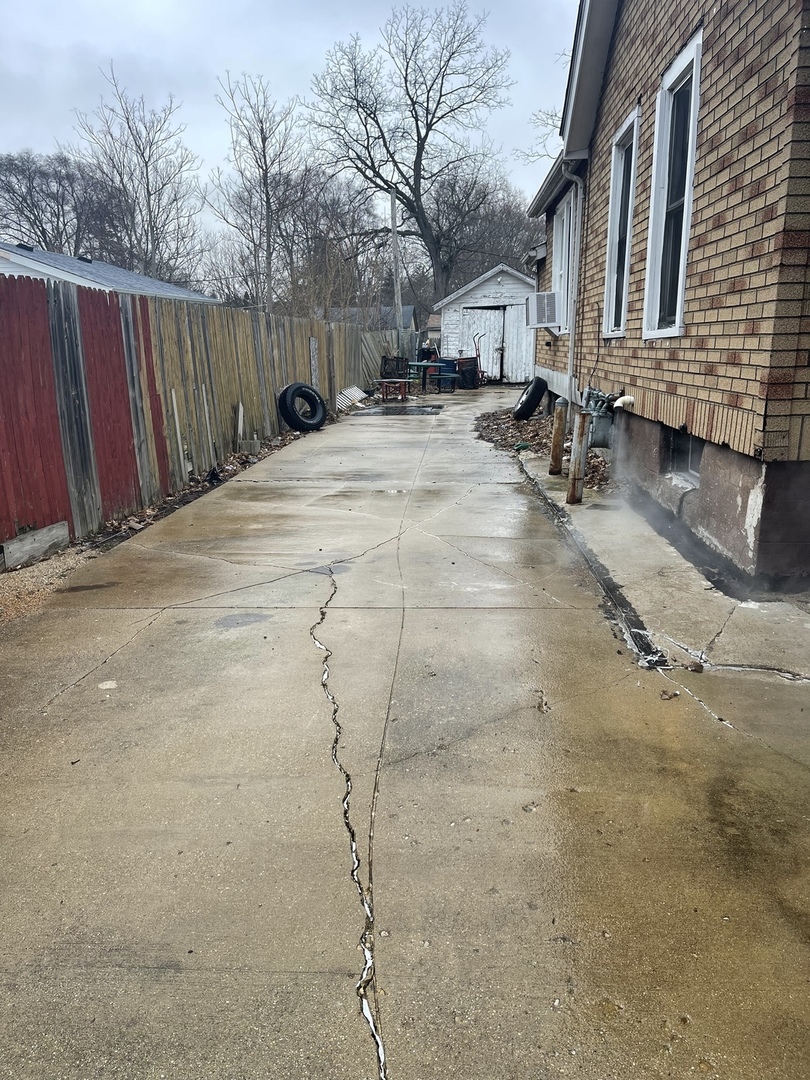 263 Beach Street Aurora, IL 60505 - Photo 6 of 6 a view of swimming pool with wooden fence