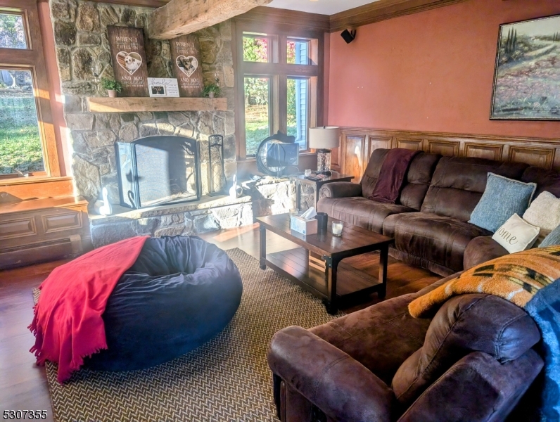 1 Dove Hollow Lane Hampton, NJ 08827 - Photo 39 of 49 a living room with furniture a fireplace and a large window