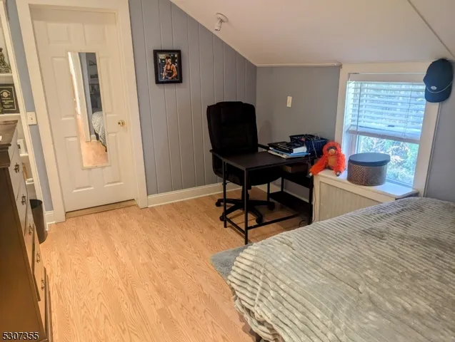 a work room with furniture and a window