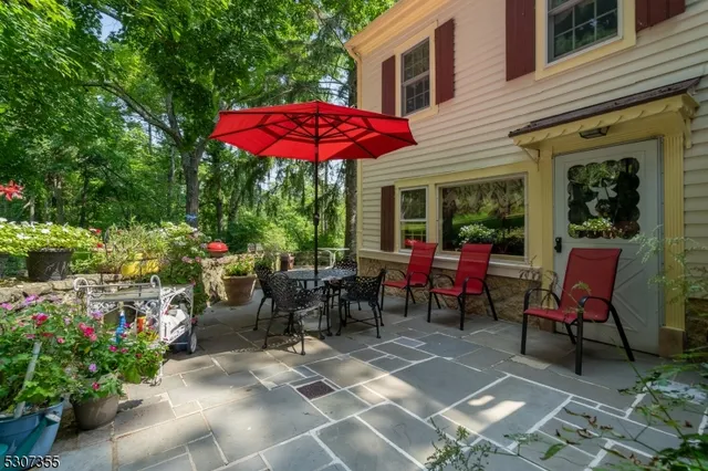 a view of a tables and chairs under an umbrella