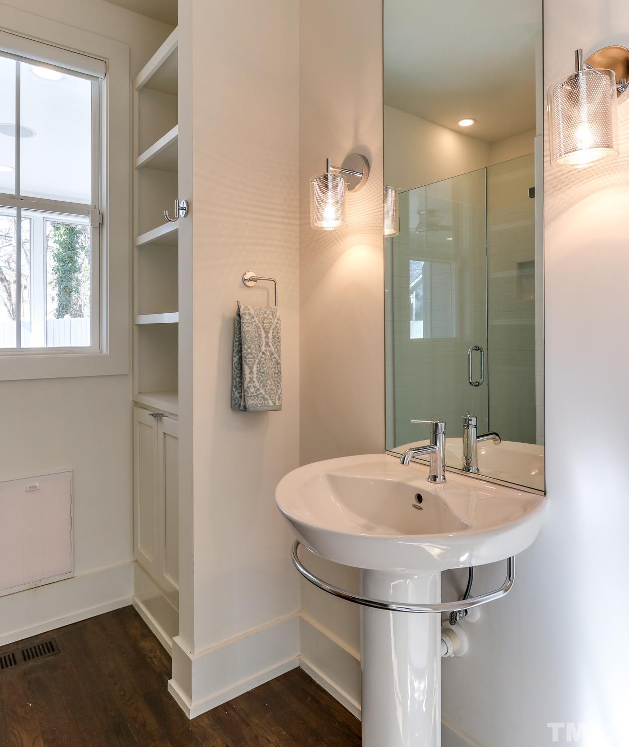 107 Revival Way Raleigh, NC 27608 - Photo 12 of 31 a bathroom with a sink and a mirror