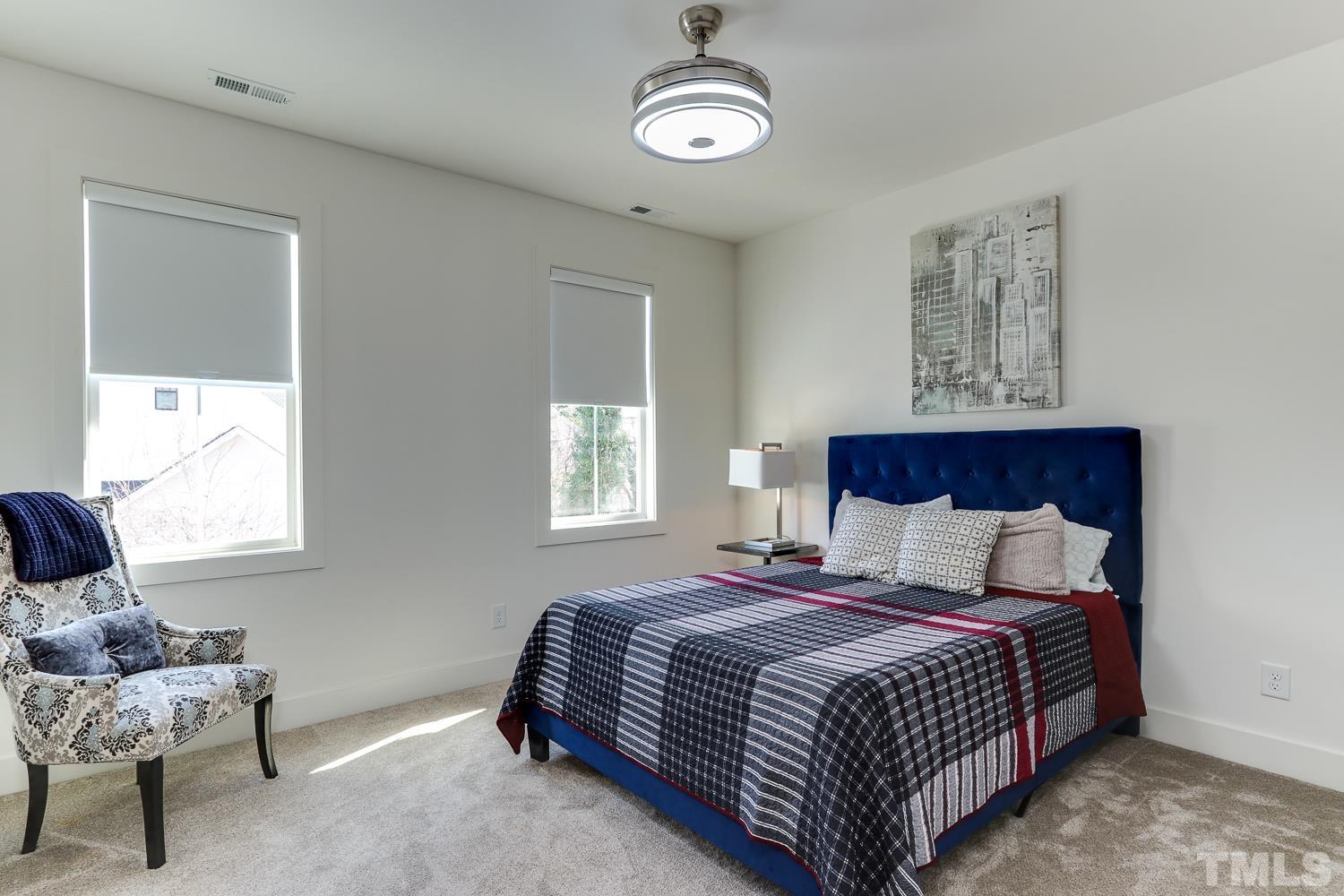 107 Revival Way Raleigh, NC 27608 - Photo 19 of 31 a bedroom with bed and window