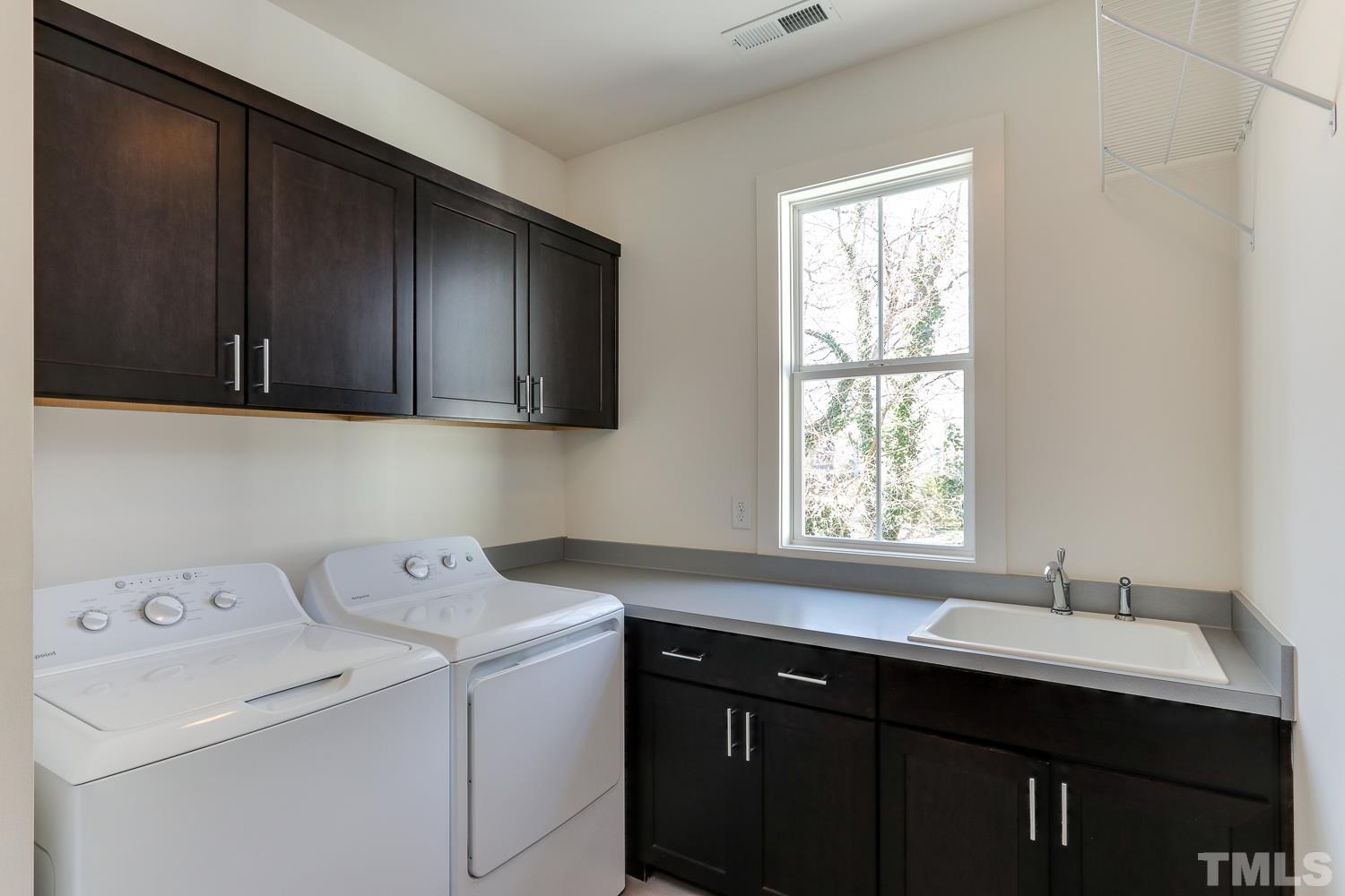 107 Revival Way Raleigh, NC 27608 - Photo 21 of 31 a utility room with a sink washer and dryer