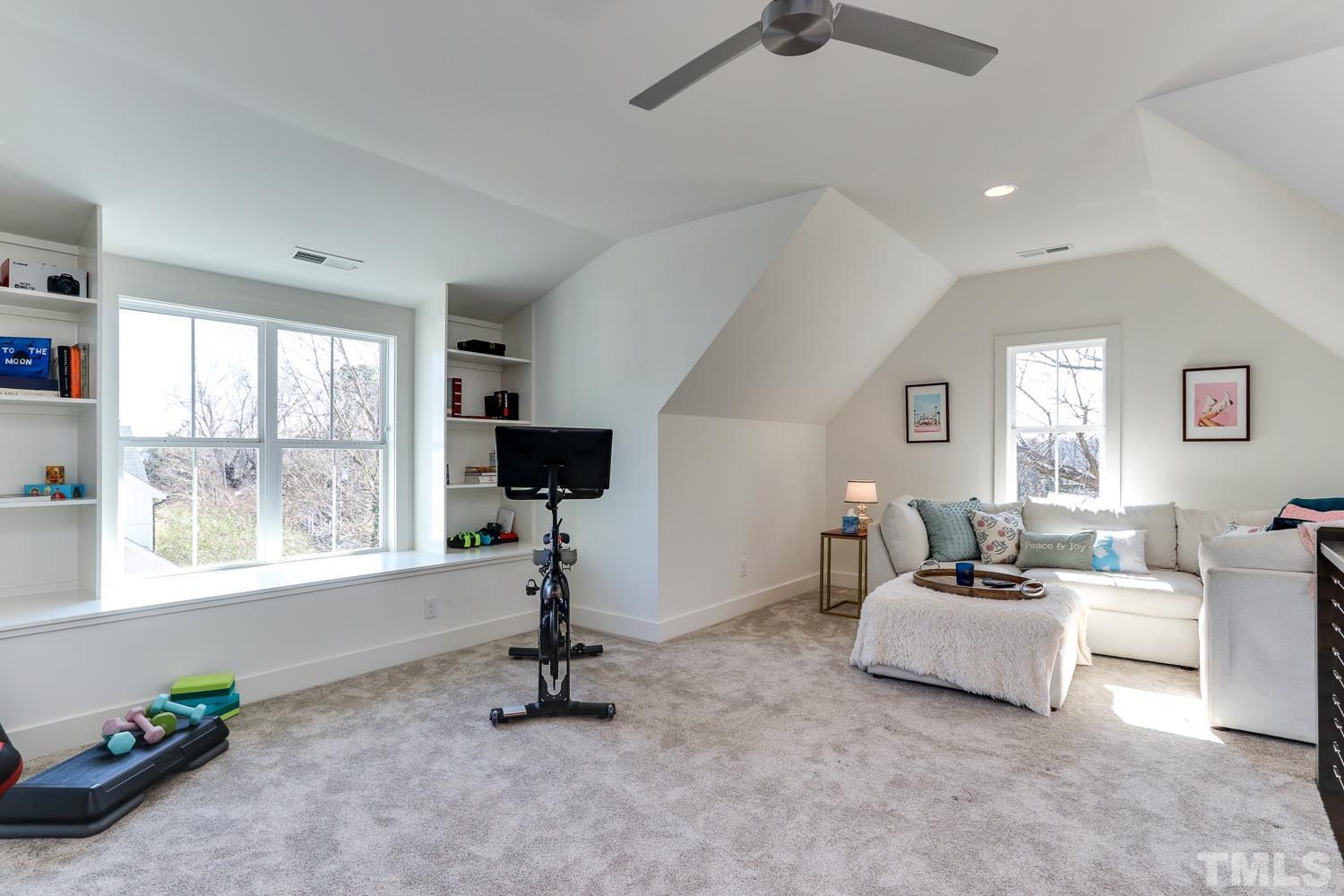 107 Revival Way Raleigh, NC 27608 - Photo 22 of 31 a living room with furniture and a flat screen tv