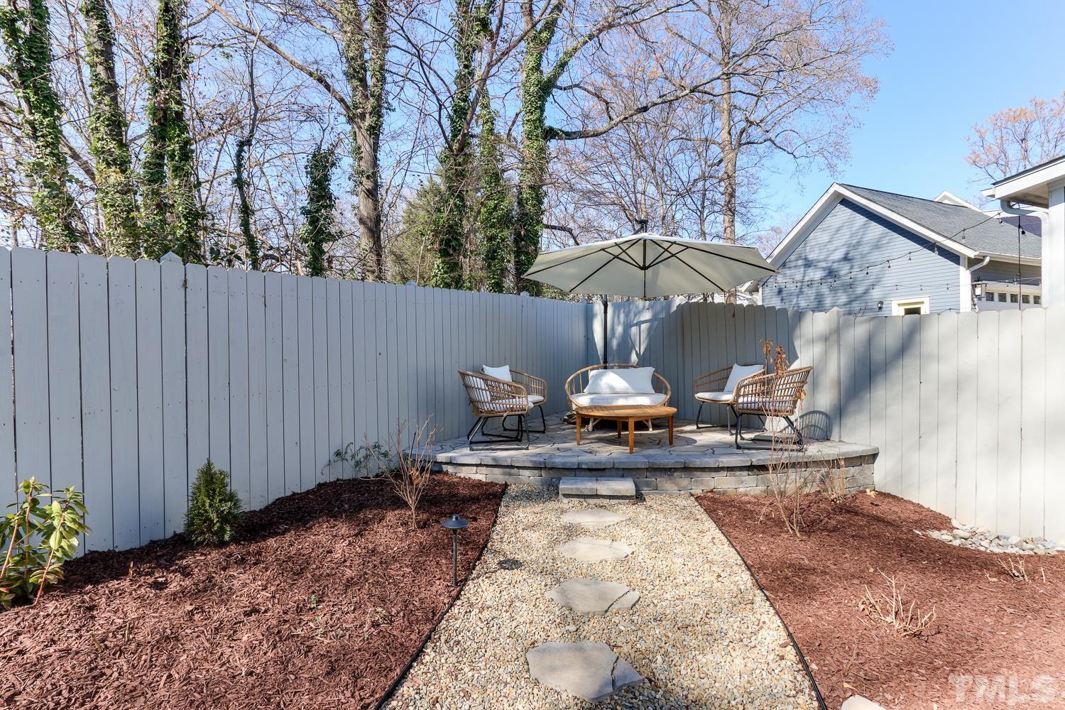 107 Revival Way Raleigh, NC 27608 - Photo 28 of 31 a view of table and chairs in the patio