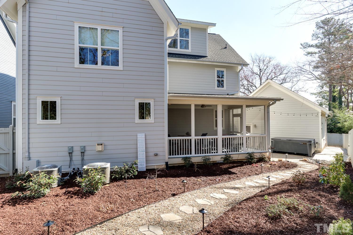107 Revival Way Raleigh, NC 27608 - Photo 29 of 31 a front view of a house with a yard