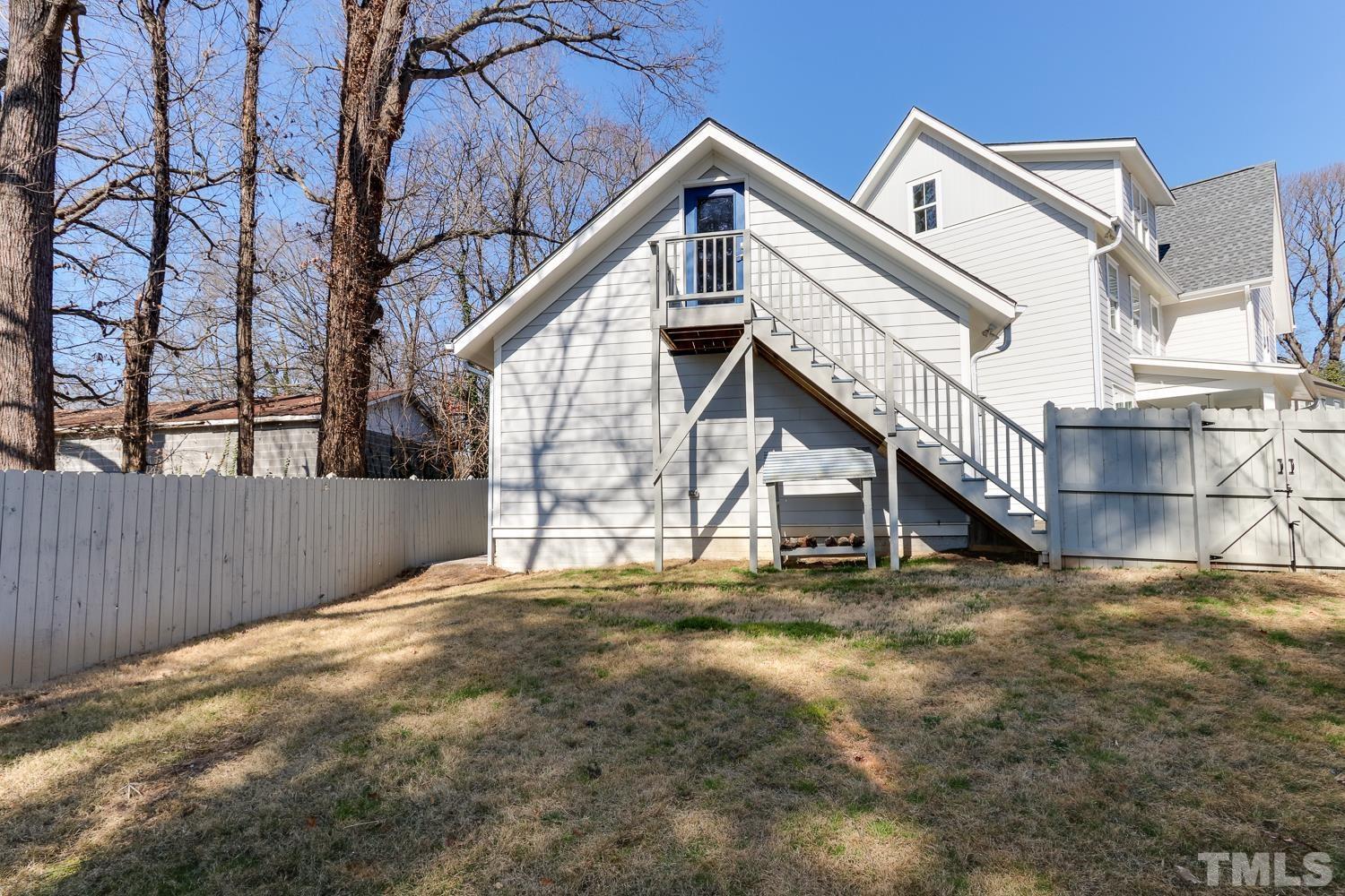 107 Revival Way Raleigh, NC 27608 - Photo 30 of 31 a view of house with a yard