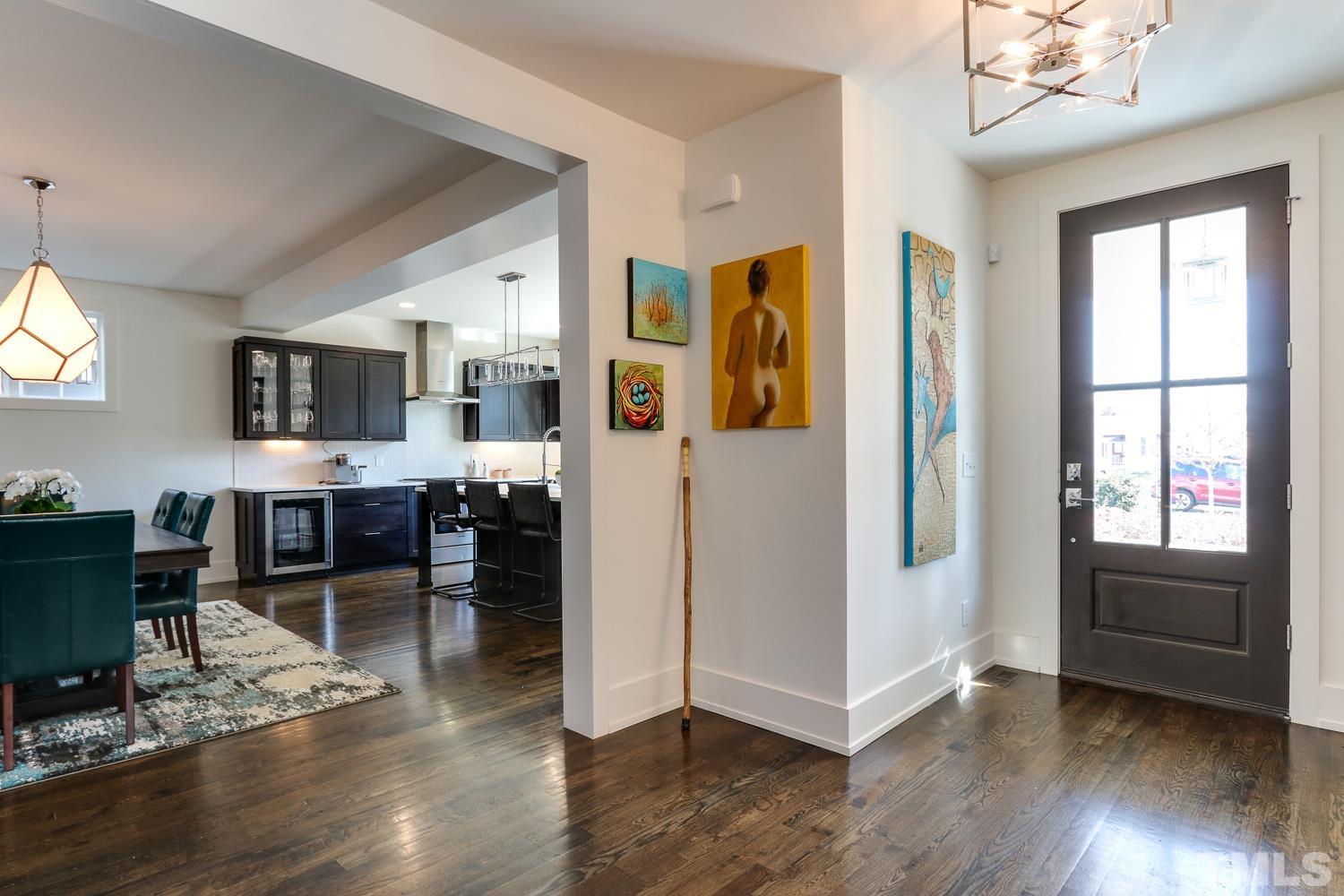 107 Revival Way Raleigh, NC 27608 - Photo 3 of 31 a view of kitchen with furniture and wooden floor