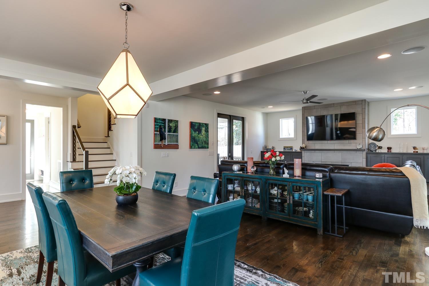 107 Revival Way Raleigh, NC 27608 - Photo 7 of 31 a view of a dining room with furniture and a chandelier
