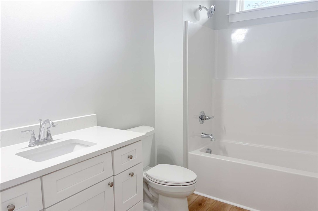2515 Highway 29 Anderson, SC 29621 - Photo 30 of 38 A well-appointed bathroom features a bright vanity, toilet, and a pristine shower-tub combination.