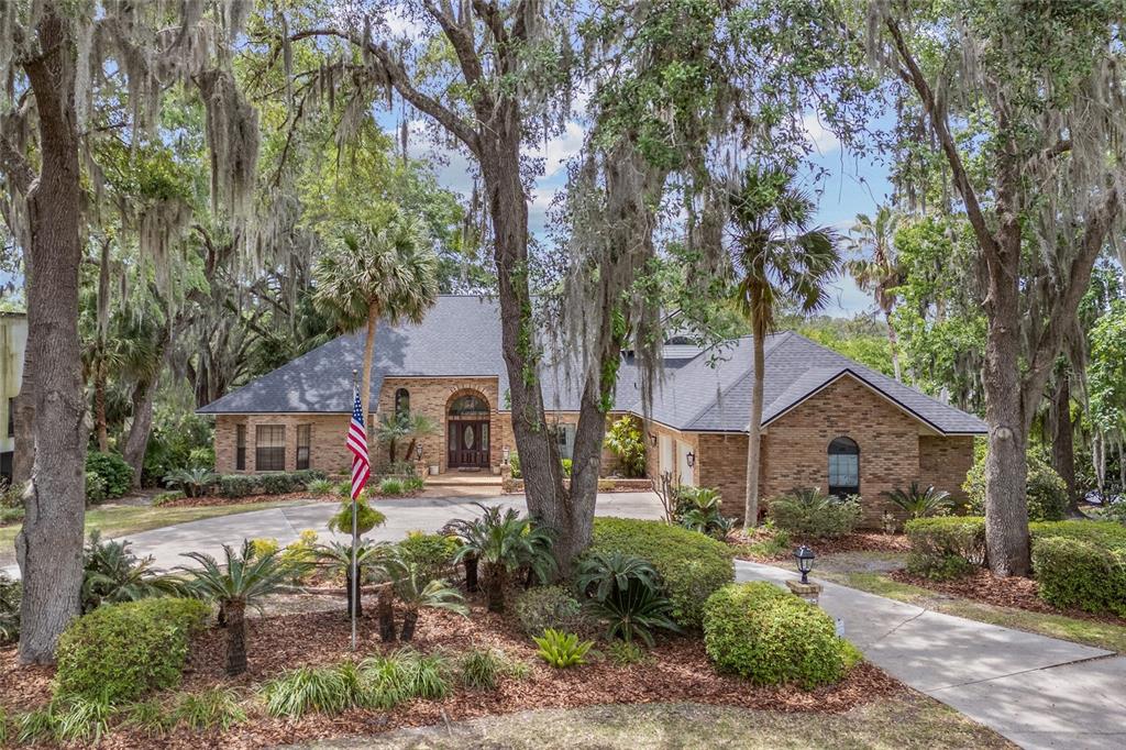 6520 Southwest 35th Way Gainesville, FL 32608 - Photo 1 of 1 a front view of house with a garden