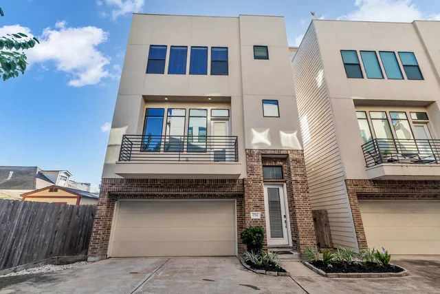 a front view of a house with a garage