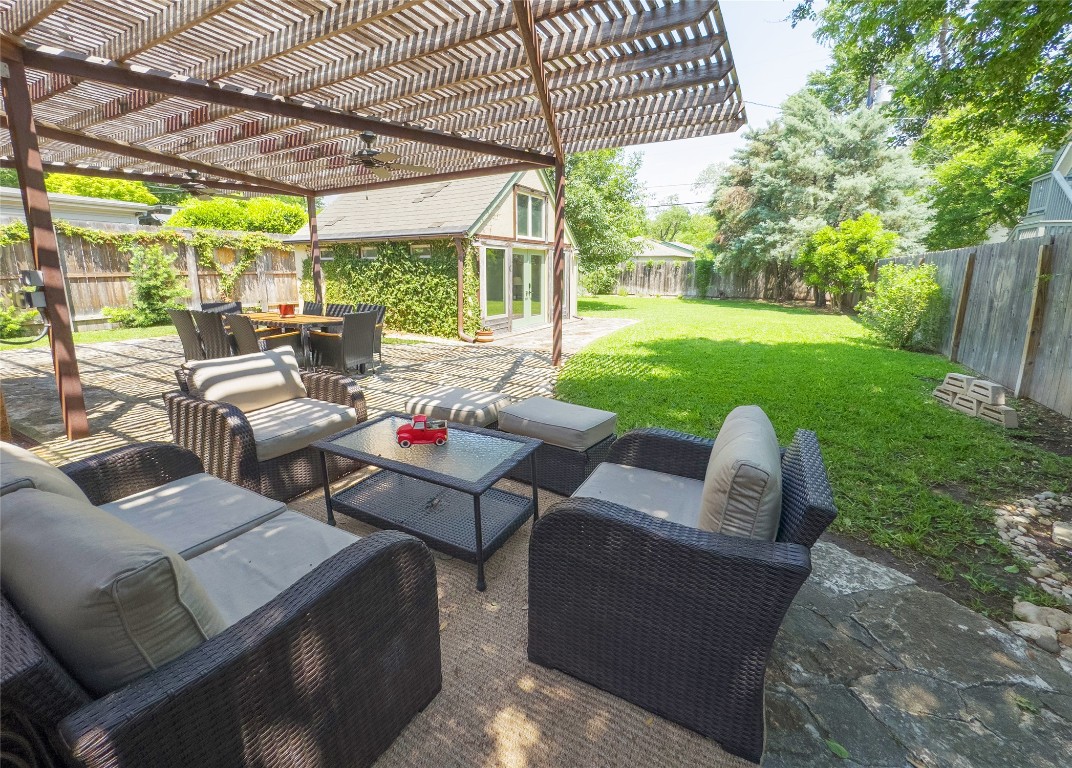 1512 Northwood Road Austin, TX 78703 - Photo 19 of 24 Fenced backyard featuring a patio, an outdoor living space, a pergola, and outdoor dining area