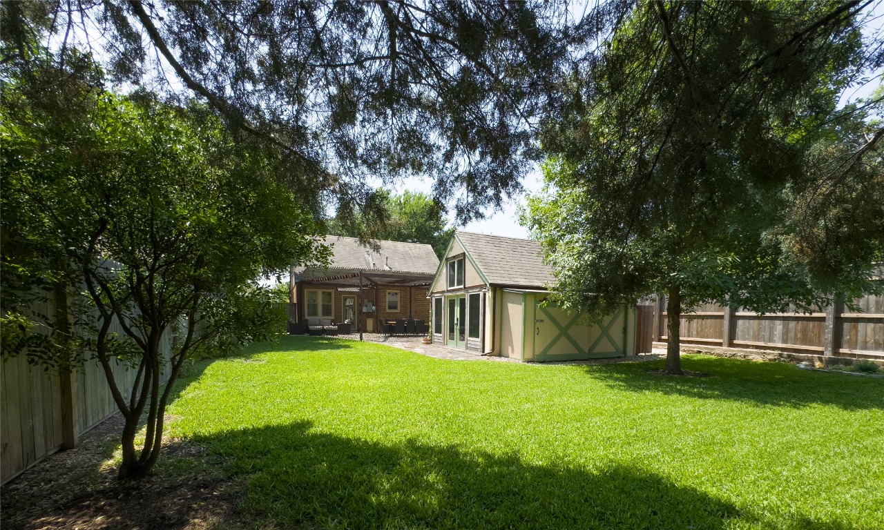 1512 Northwood Road Austin, TX 78703 - Photo 22 of 24 Fenced backyard with a patio