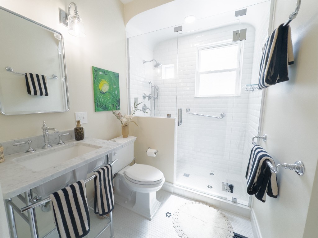 1512 Northwood Road Austin, TX 78703 - Photo 4 of 24 Bathroom featuring toilet and a shower stall