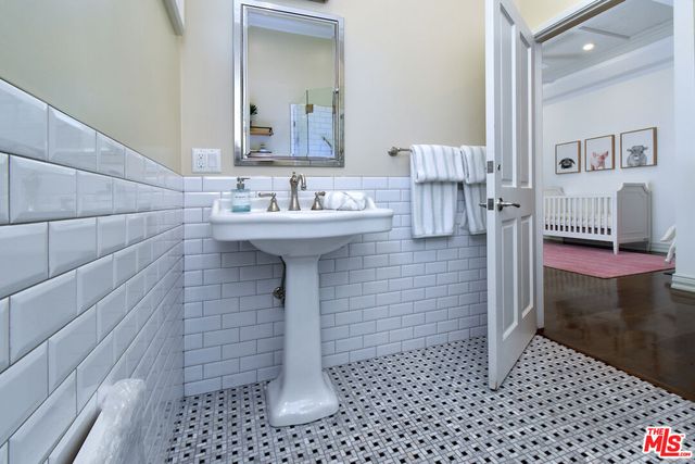 a living room with furniture a rug and a large window