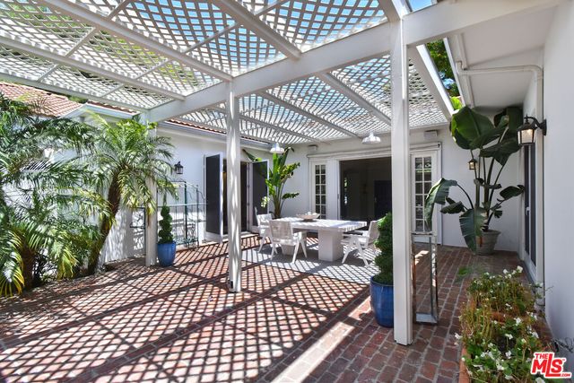 a view of a wooden deck and a yard