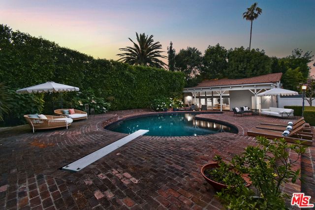 a view of a dining hall with many windows
