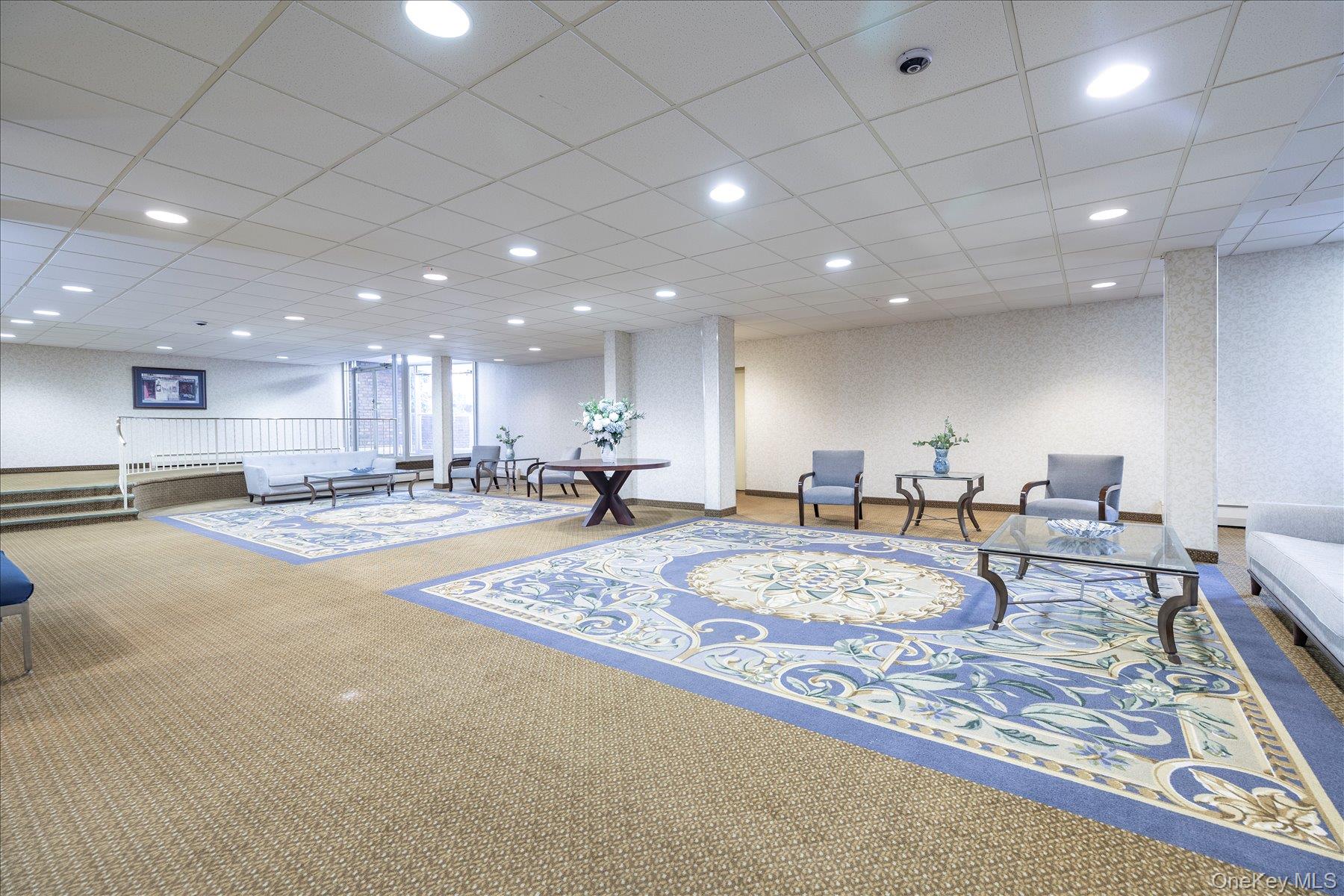2 Fowler Avenue, Unit 211 Lynbrook, NY 11563 - Photo 17 of 19 a view of a center kitchen and living room