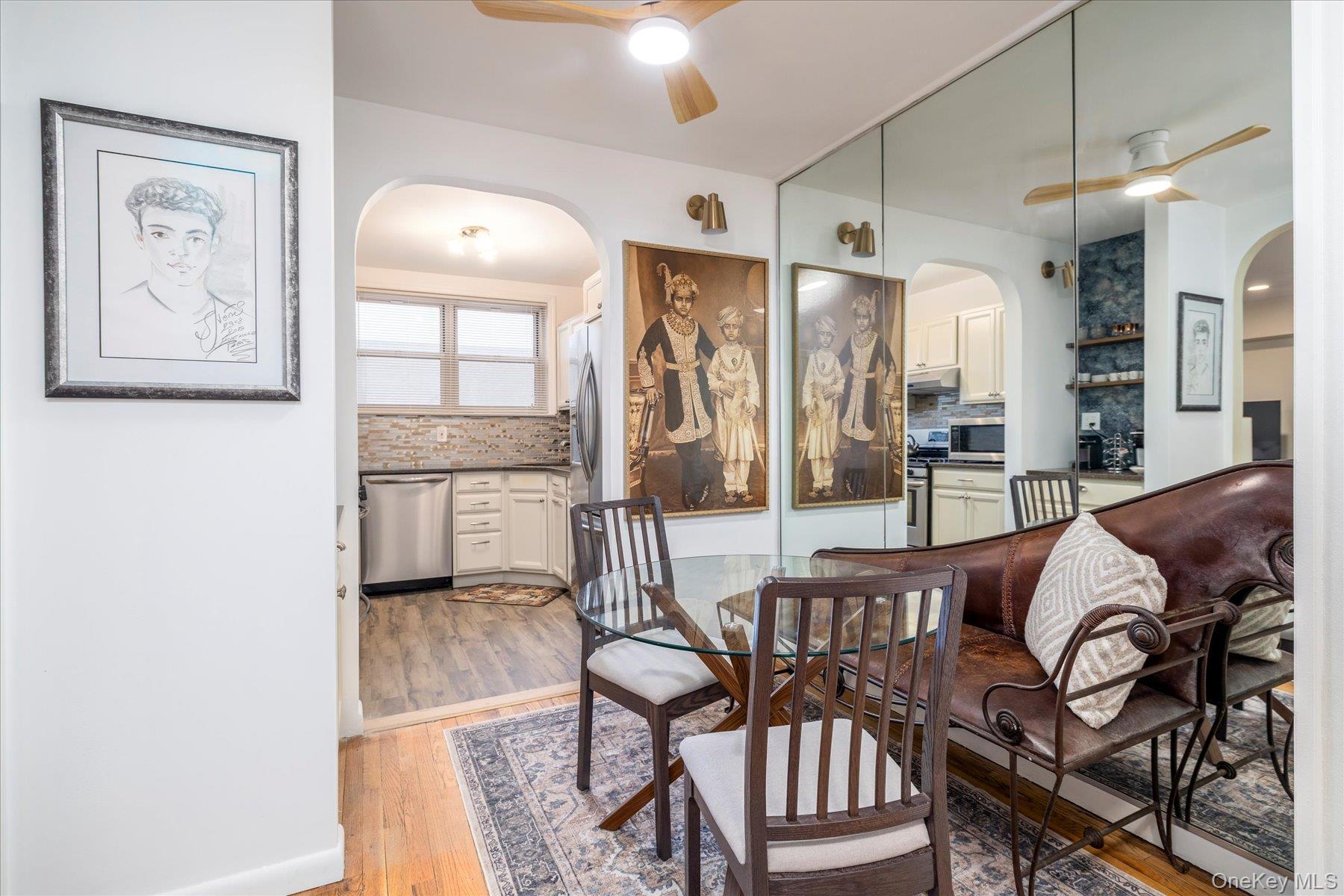 2 Fowler Avenue, Unit 211 Lynbrook, NY 11563 - Photo 2 of 19 a living room with furniture and a large window