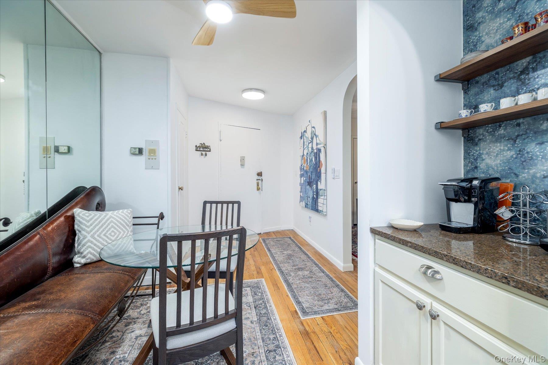 2 Fowler Avenue, Unit 211 Lynbrook, NY 11563 - Photo 5 of 19 a living room with furniture and wooden floor