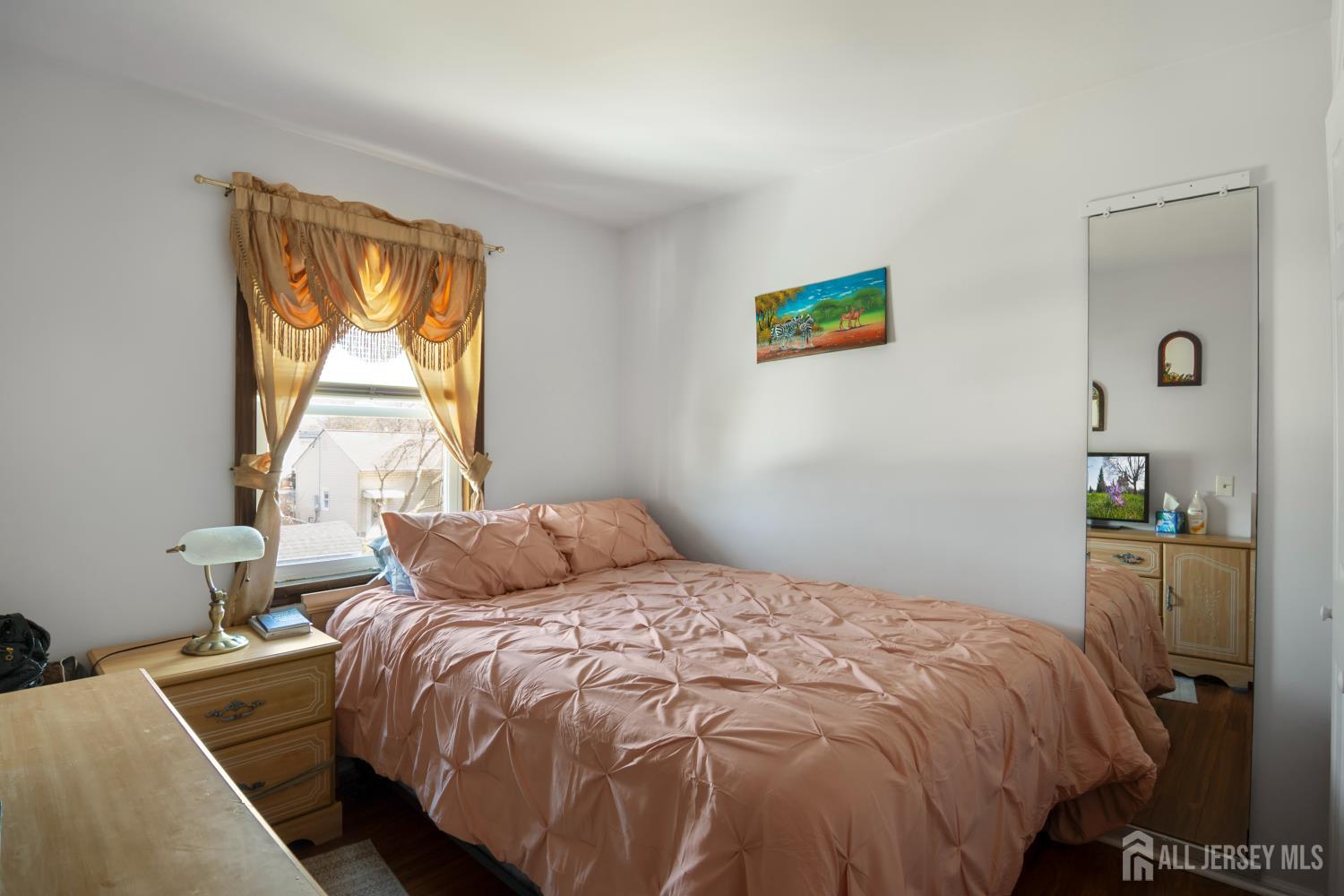 118 Wilton Avenue Middlesex, NJ 08846 - Photo 11 of 24 a bedroom with a bed and a window
