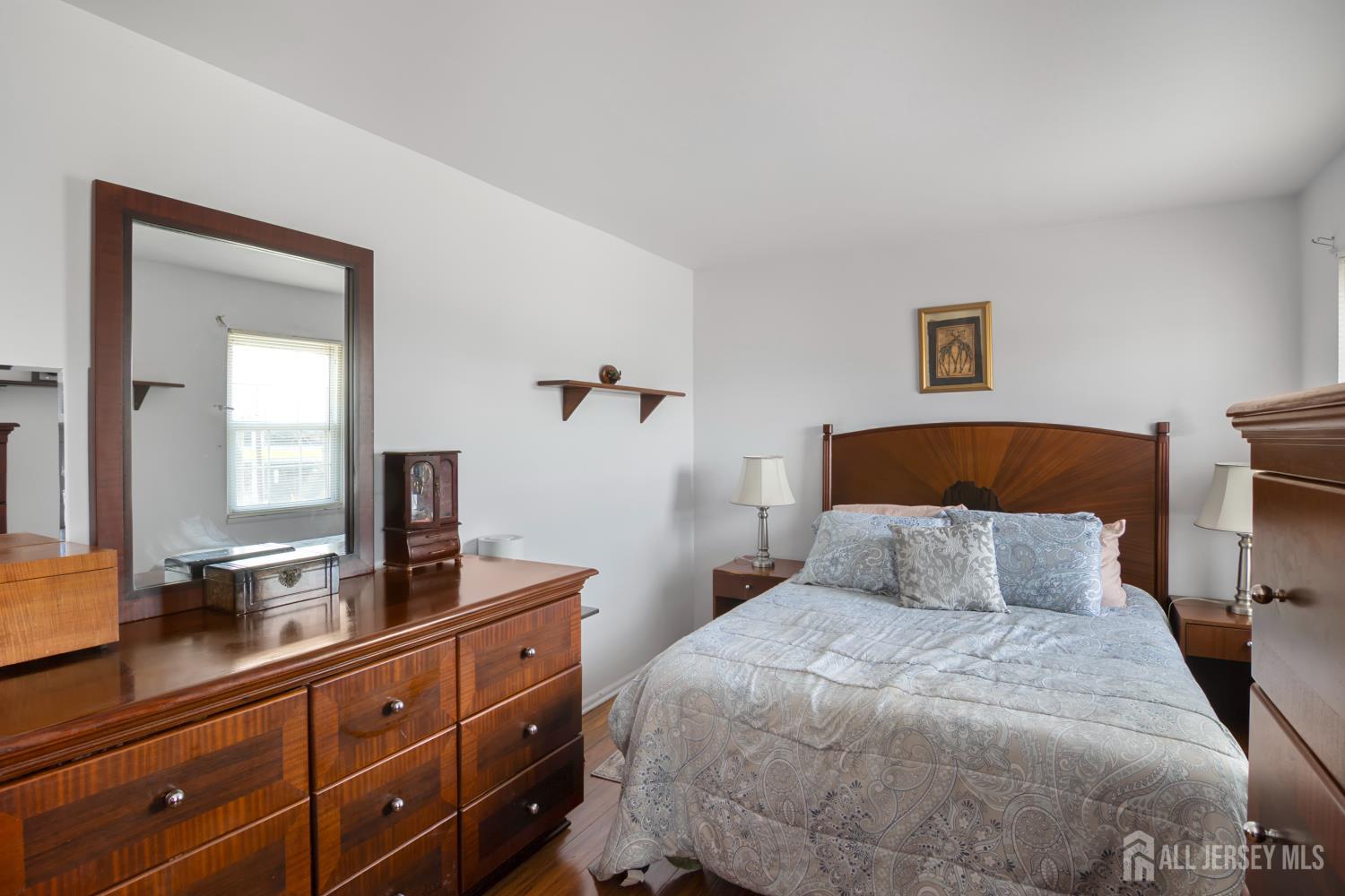 118 Wilton Avenue Middlesex, NJ 08846 - Photo 12 of 24 a bedroom with a bed and a dresser