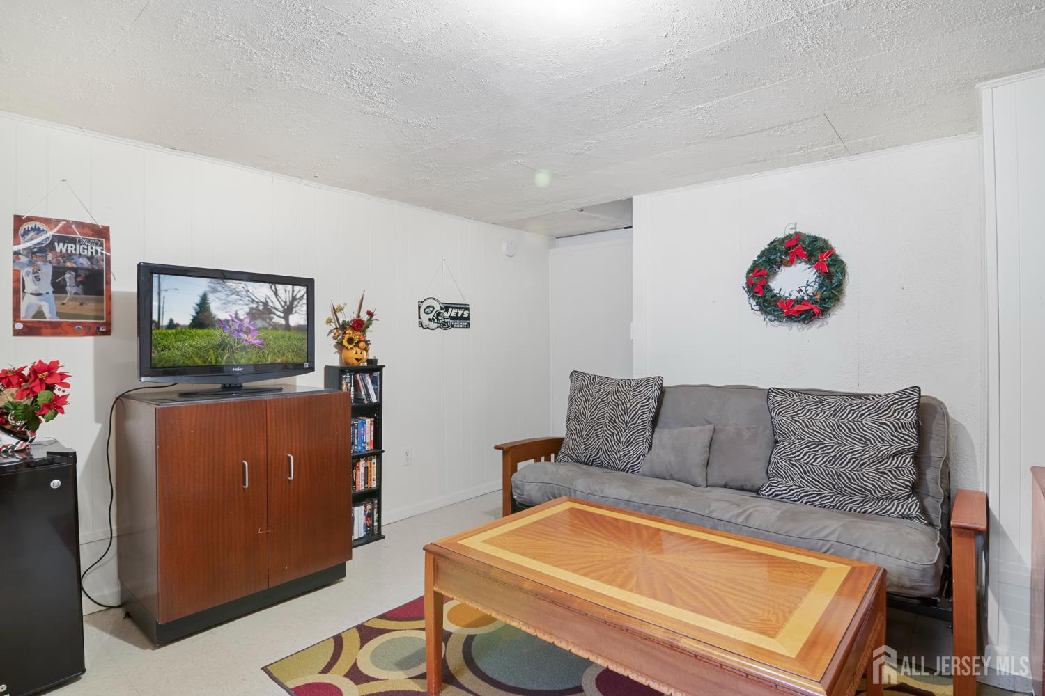 118 Wilton Avenue Middlesex, NJ 08846 - Photo 14 of 24 a living room with furniture and a flat screen tv