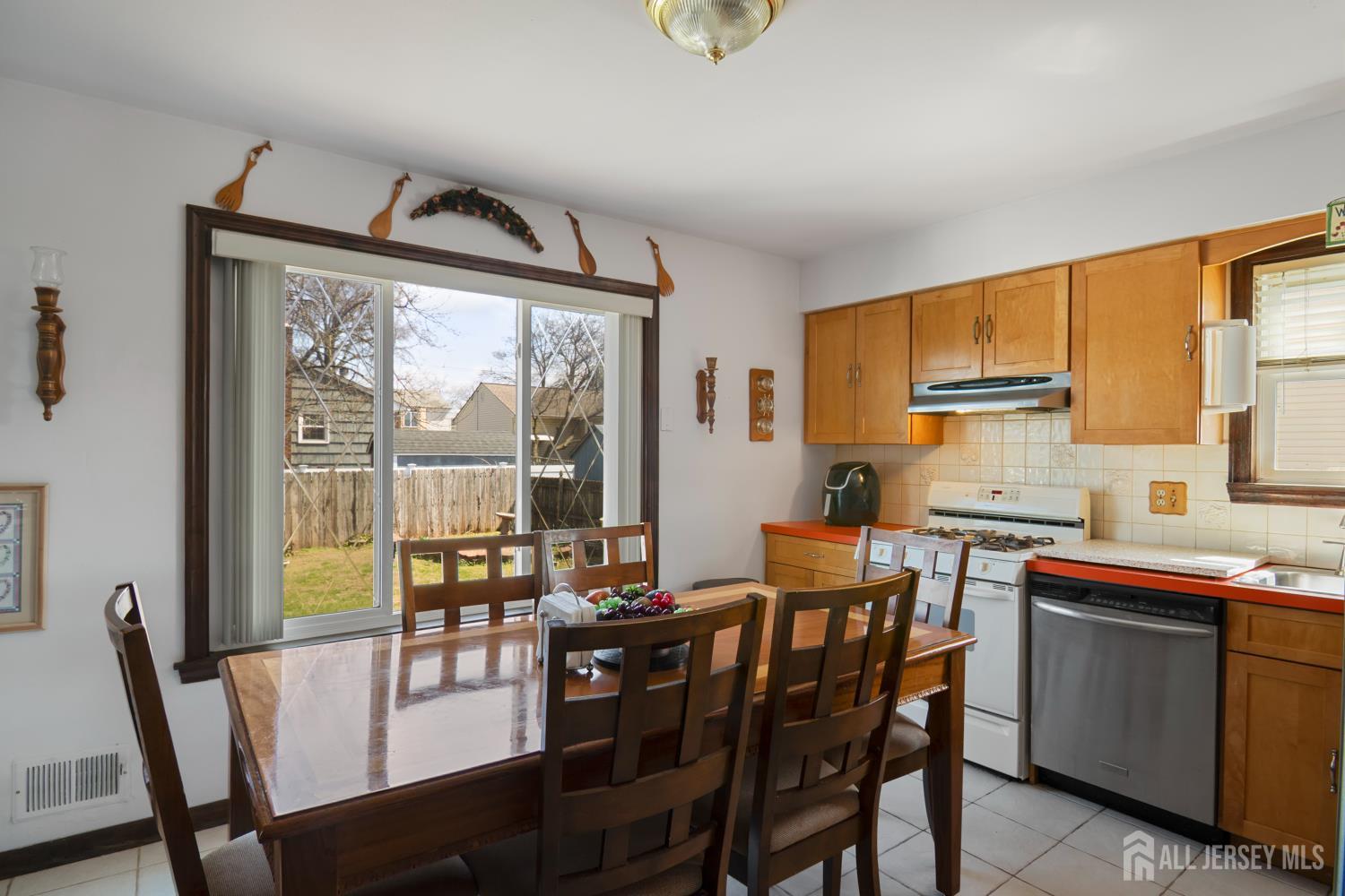 118 Wilton Avenue Middlesex, NJ 08846 - Photo 7 of 24 a view of a dining room with furniture window and outside view