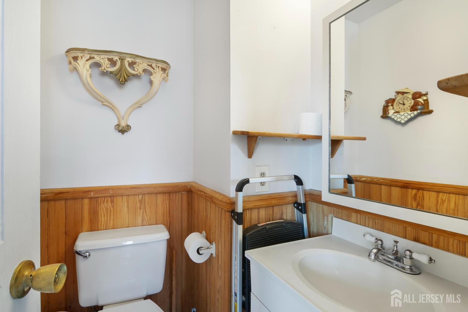 118 Wilton Avenue Middlesex, NJ 08846 - Photo 9 of 24 a bathroom with a sink and a mirror