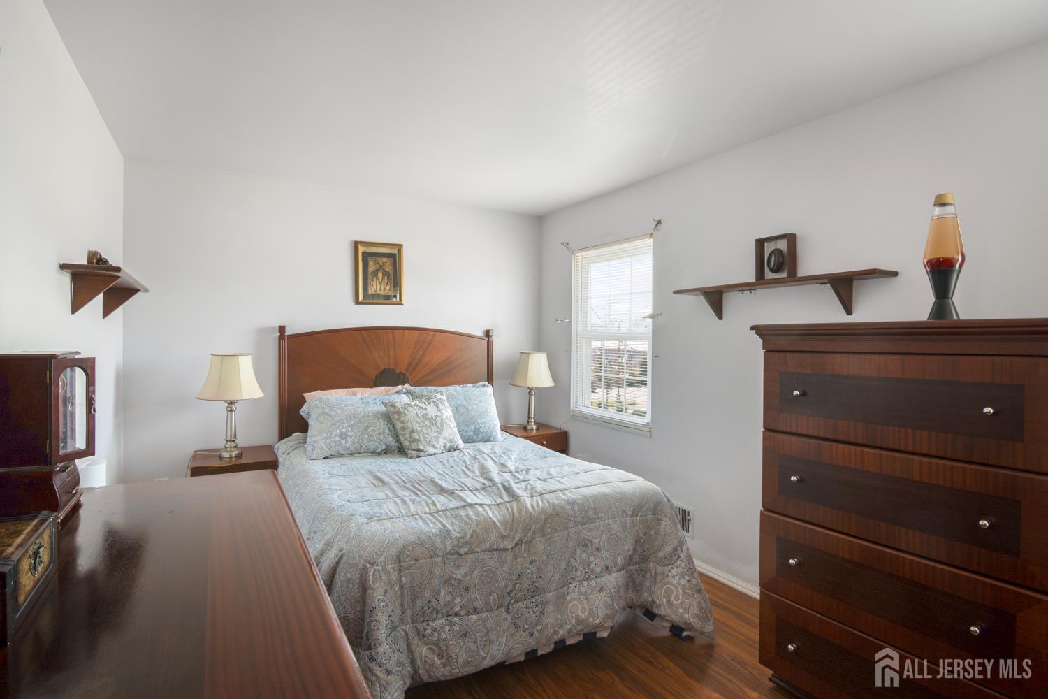 118 Wilton Avenue Middlesex, NJ 08846 - Photo 10 of 24 a bedroom with a bed and a tv