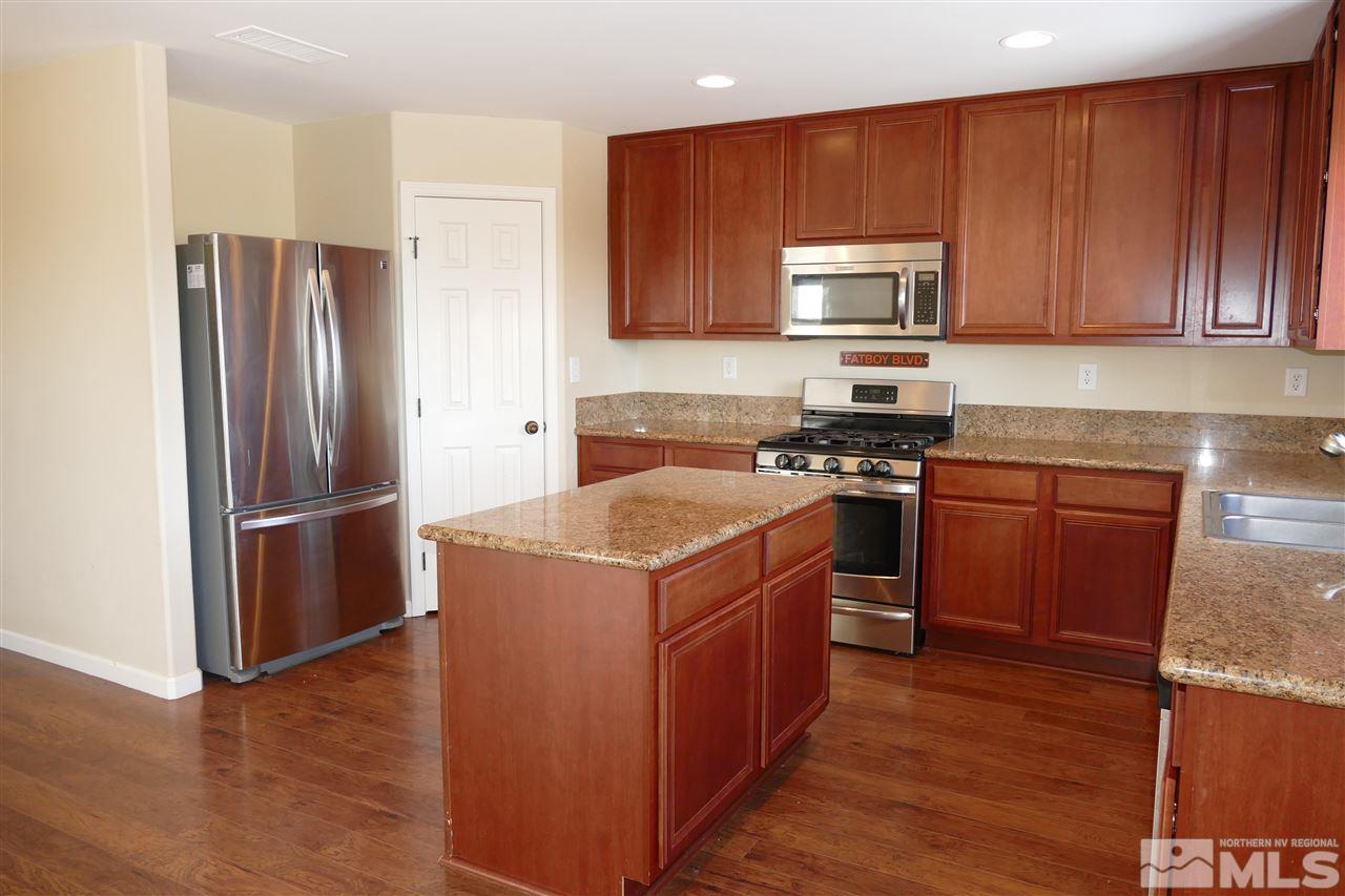 2880 Bryan Street Reno, NV 89503 - Photo 3 of 20 a kitchen with a refrigerator sink and microwave