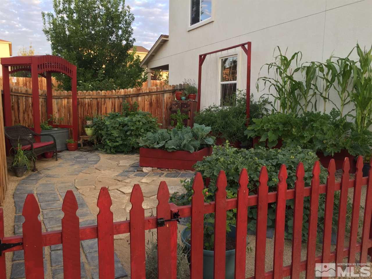 2880 Bryan Street Reno, NV 89503 - Photo 7 of 20 a view of a yard with plants and wooden fence