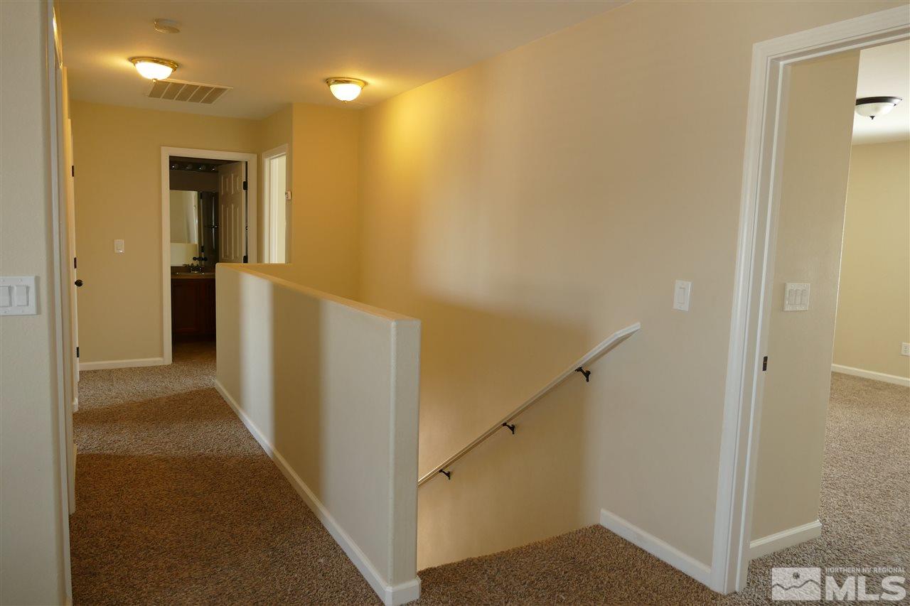 2880 Bryan Street Reno, NV 89503 - Photo 10 of 20 a view of a hallway with white walls and stairs